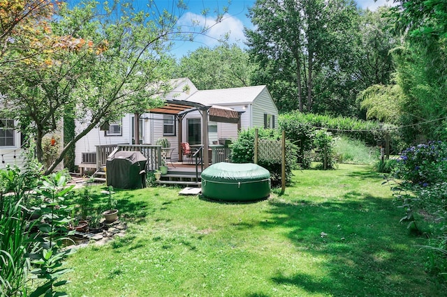 7 Clover Ln, Brookhaven, NY 11719 - view of green lawn featuring a wooden deck and a pergola