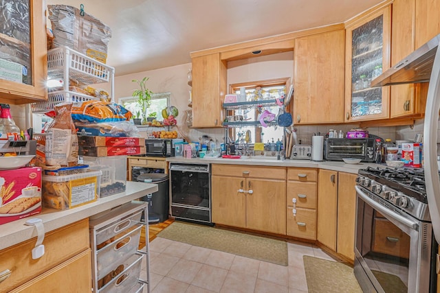 118 Edmund, Lynbrook, NY 11563 - kitchen with dishwasher, stainless steel range with gas cooktop, light countertops, light tile patterned floors, and extractor fan