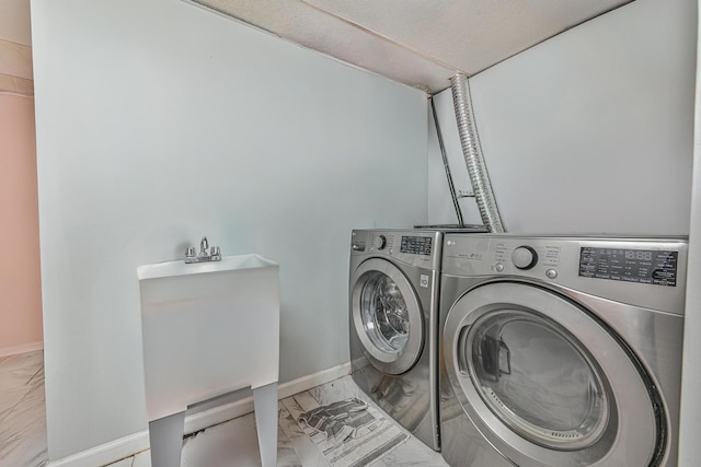 118 Edmund, Lynbrook, NY 11563 - laundry area with marble look tile flooring and washer and dryer