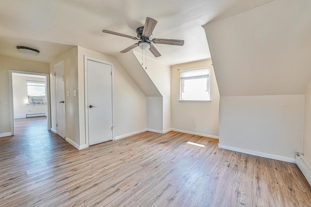 118 Edmund, Lynbrook, NY 11563 - bonus room featuring wood finished floors, ceiling fan, a baseboard radiator, and lofted ceiling