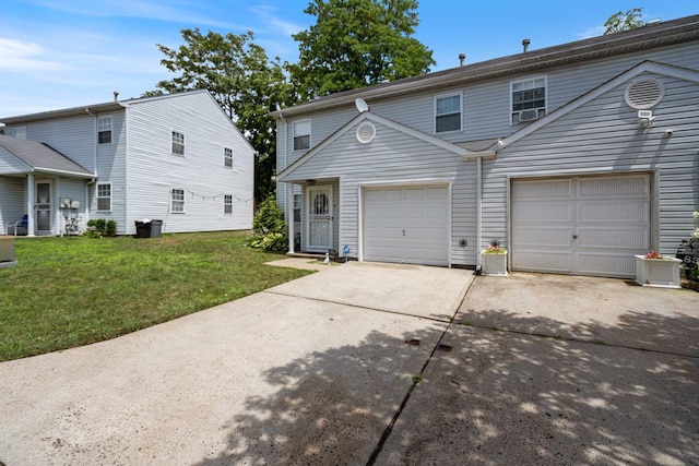 81 Baldwin Rd, Hempstead, NY 11550 - multi unit property featuring concrete driveway, a front lawn, and a garage