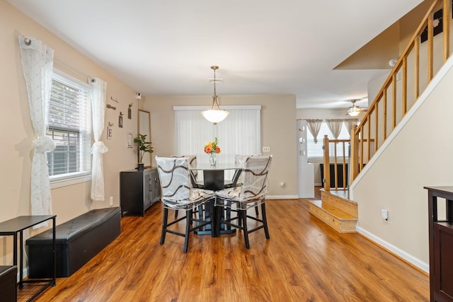 81 Baldwin Rd, Hempstead, NY 11550 - dining room featuring stairway, wood finished floors, and a ceiling fan
