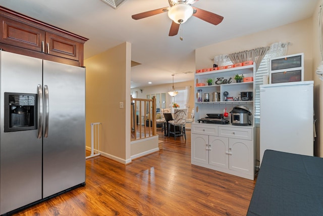 81 Baldwin Rd, Hempstead, NY 11550 - kitchen with stainless steel fridge, wood finished floors, ceiling fan, and open shelves