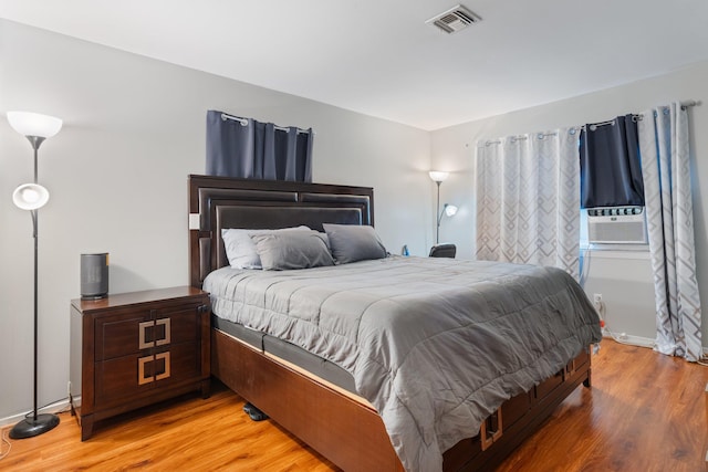 81 Baldwin Rd, Hempstead, NY 11550 - bedroom with light wood-style flooring and cooling unit