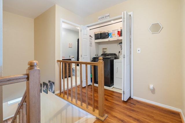 81 Baldwin Rd, Hempstead, NY 11550 - corridor with an upstairs landing, separate washer and dryer, and wood finished floors