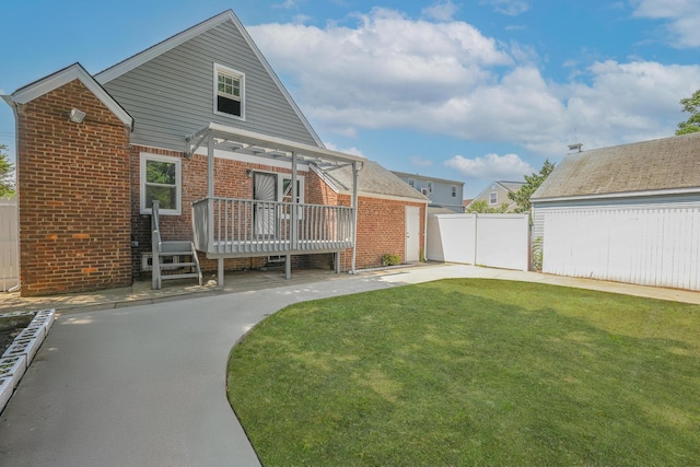 73 Broadway, Valley Stream, NY 11580 - back of property featuring a wooden deck and brick siding