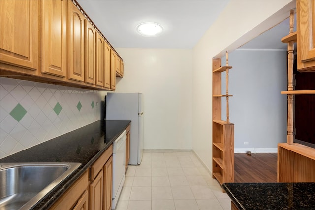 84-39 153rd Ave Unit 1K, Flushing, NY 11414 - kitchen with open shelves, decorative backsplash, white appliances, and dark stone counters