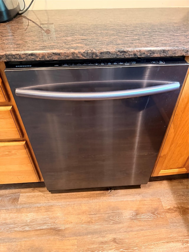 69 Finkle Rd, Summitville, NY 12790 - kitchen view of dishwasher, wood finished floors, dark countertops, and brown cabinetry