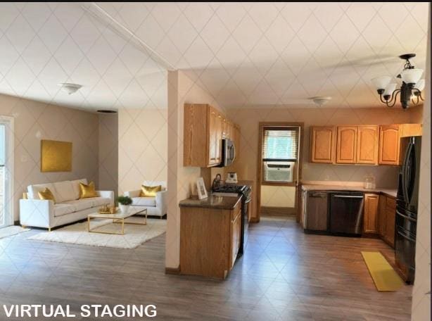 69 Finkle Rd, Summitville, NY 12790 - kitchen featuring dishwasher, range with gas cooktop, open floor plan, dark wood finished floors, and freestanding refrigerator