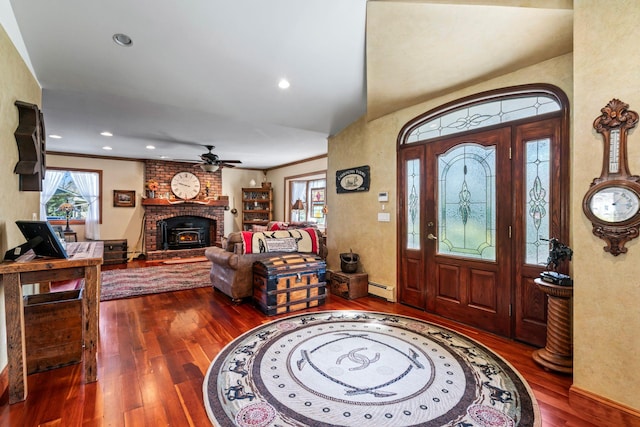 24 Croft Ln, Smithtown, NY 11787 - foyer entrance featuring hardwood / wood-style floors, a baseboard radiator, a ceiling fan, recessed lighting, and a brick fireplace