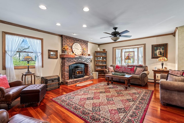 24 Croft Ln, Smithtown, NY 11787 - living room featuring ornamental molding, a ceiling fan, wood finished floors, baseboard heating, and a wood stove