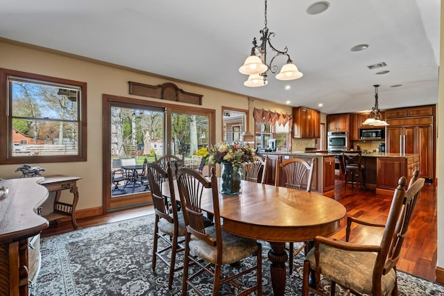 24 Croft Ln, Smithtown, NY 11787 - dining area featuring dark wood-style flooring, a chandelier, lofted ceiling, and recessed lighting