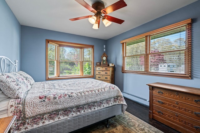 24 Croft Ln, Smithtown, NY 11787 - bedroom with a baseboard heating unit, wood finished floors, and a ceiling fan