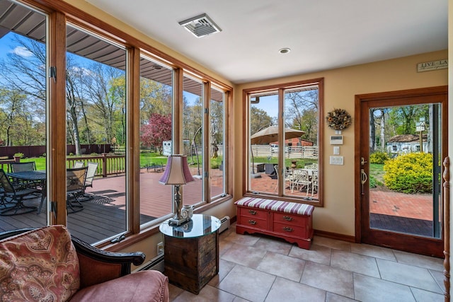 24 Croft Ln, Smithtown, NY 11787 - sunroom / solarium with a wooden deck and a baseboard radiator