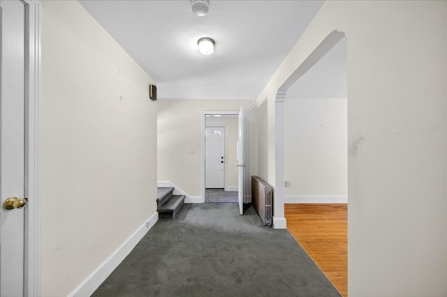 1095 State Route 94, New Windsor, NY 12553 - hallway featuring radiator, stairs, and carpet