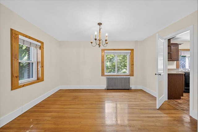 1095 State Route 94, New Windsor, NY 12553 - unfurnished dining area with radiator, plenty of natural light, and a chandelier