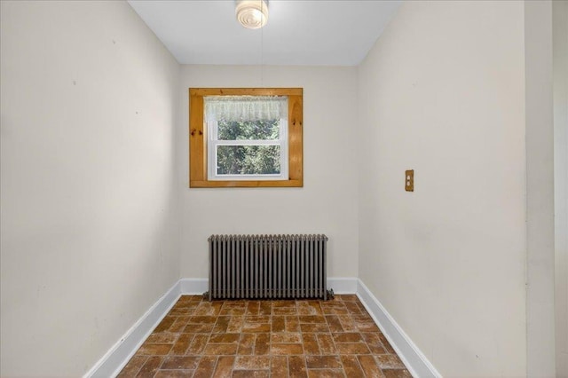 1095 State Route 94, New Windsor, NY 12553 - unfurnished room with radiator and dark stone finish floors