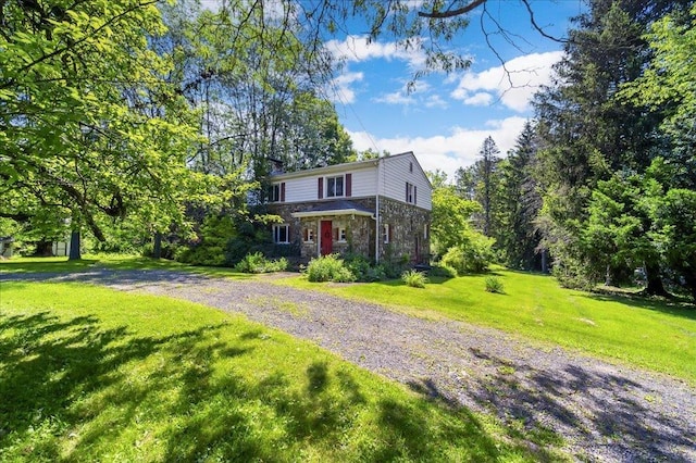 1095 State Route 94, New Windsor, NY 12553 - view of front facade featuring stone siding, gravel driveway, and a front yard