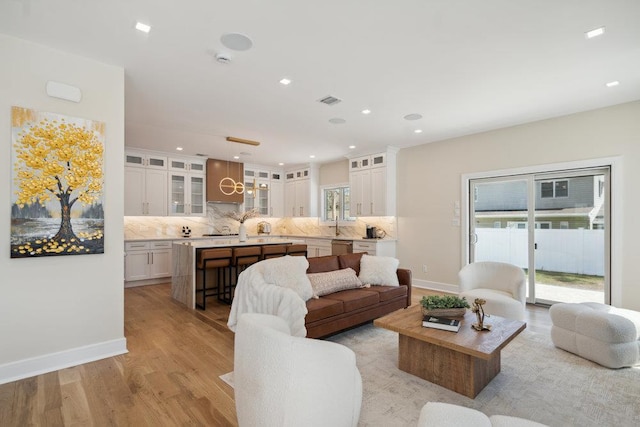 11 Vernon St, Plainview, NY 11803 - living room with light wood-style flooring and recessed lighting