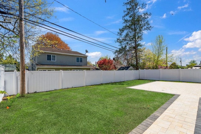11 Vernon St, Plainview, NY 11803 - fenced backyard with a patio area