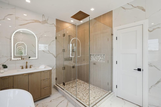 11 Vernon St, Plainview, NY 11803 - full bathroom featuring marble tiled flooring, a shower stall, a freestanding bath, and vanity