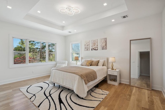 11 Vernon St, Plainview, NY 11803 - bedroom with a tray ceiling, light wood-type flooring, and recessed lighting