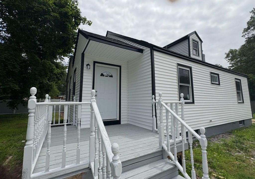 54 Park St, Centereach, NY 11720 - view of front of house with a front lawn