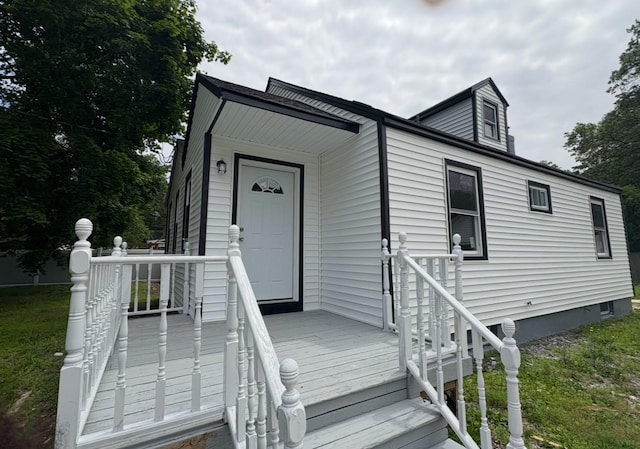 54 Park St, Centereach, NY 11720 - view of front of house with a front lawn
