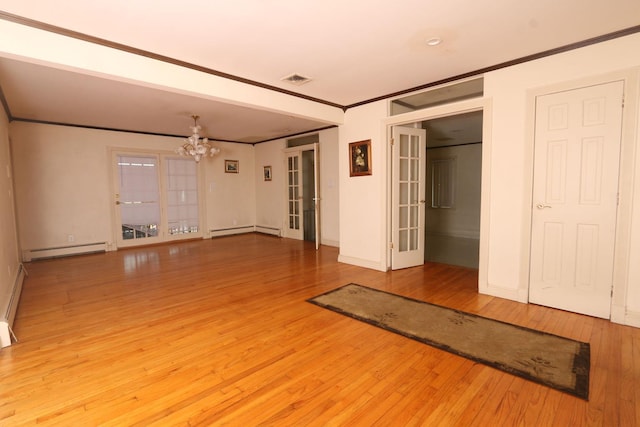 148 Spruce St, Lindenhurst, NY 11757 - unfurnished room with a chandelier, a baseboard heating unit, ornamental molding, a baseboard radiator, and french doors