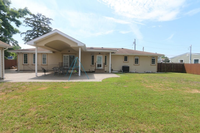 148 Spruce St, Lindenhurst, NY 11757 - rear view of house with stucco siding, a patio area, and entry steps