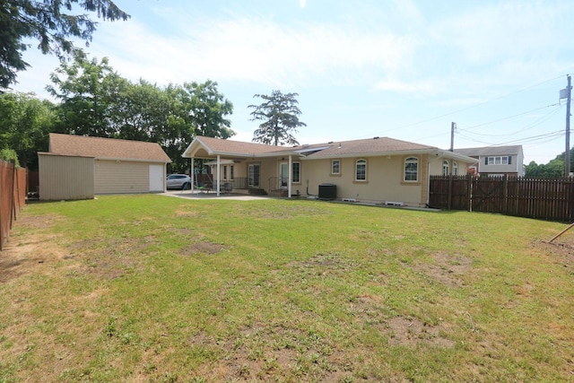 148 Spruce St, Lindenhurst, NY 11757 - rear view of property with a fenced backyard, a patio, and an outdoor structure