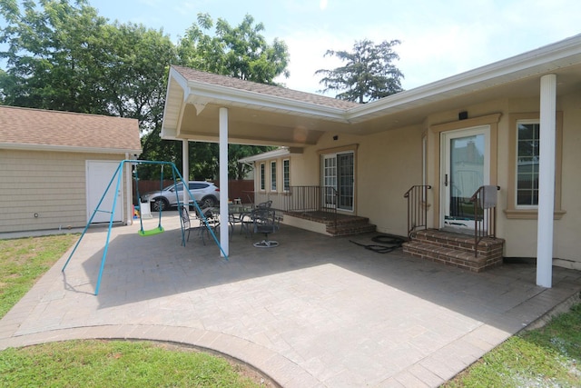 148 Spruce St, Lindenhurst, NY 11757 - view of patio featuring an outbuilding and outdoor dining space