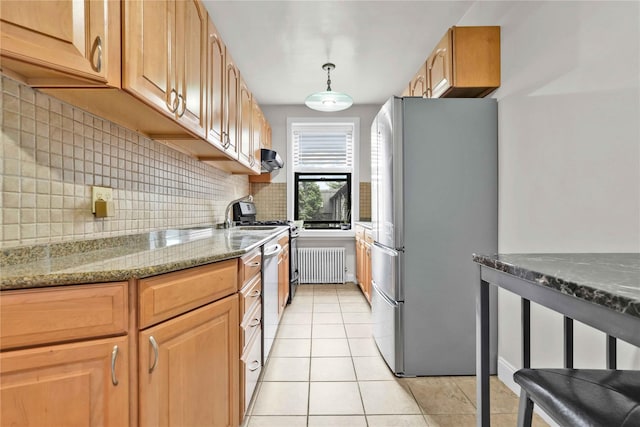 21-40 78th St Unit 2, East Elmhurst, NY 11370 - kitchen featuring stainless steel appliances, radiator, backsplash, light stone countertops, and light tile patterned floors