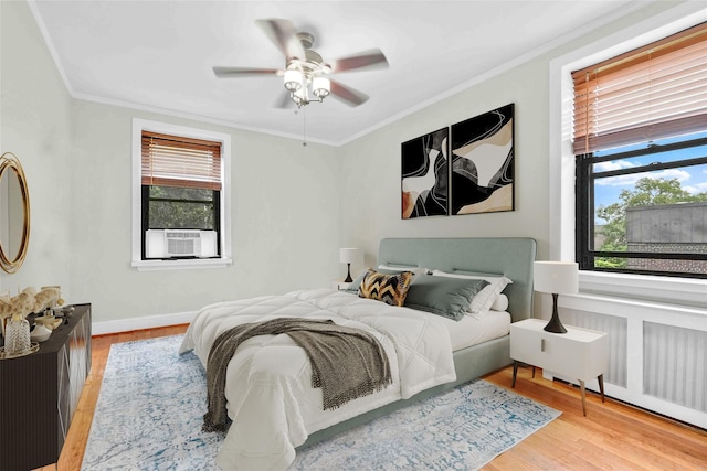 21-40 78th St Unit 2, East Elmhurst, NY 11370 - bedroom featuring cooling unit, crown molding, wood finished floors, and ceiling fan