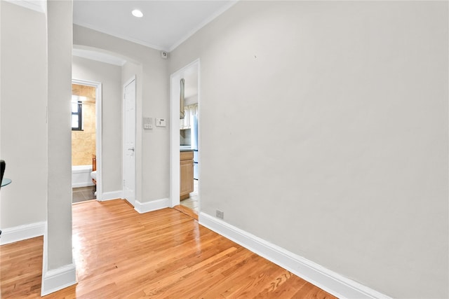 21-40 78th St Unit 2, East Elmhurst, NY 11370 - hallway with arched walkways, crown molding, light wood-style floors, and recessed lighting
