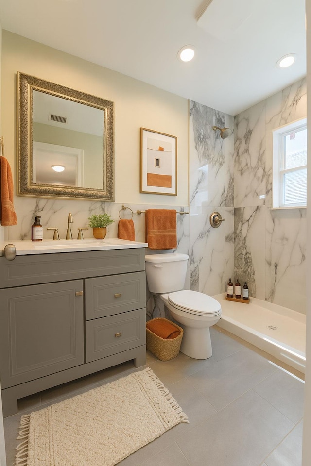 176 Hillsboro Ave, Elmont, NY 11003 - full bath featuring tile walls, vanity, a marble finish shower, recessed lighting, and tile patterned floors
