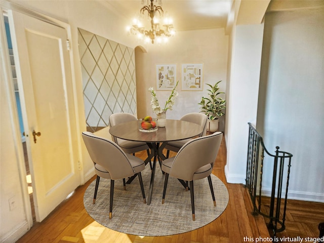 7215 37th Ave Unit 3H, Jackson Heights, NY 11372 - dining space featuring a chandelier and baseboards