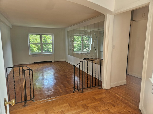 7215 37th Ave Unit 3H, Jackson Heights, NY 11372 - spare room featuring arched walkways and radiator heating unit