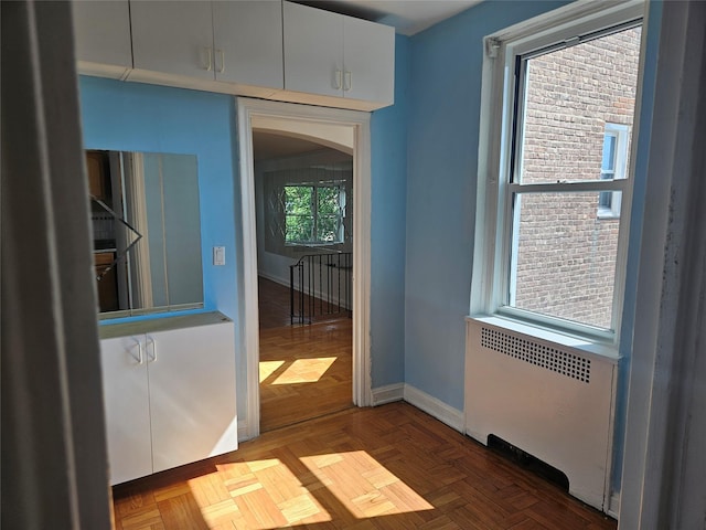 7215 37th Ave Unit 3H, Jackson Heights, NY 11372 - empty room featuring radiator and arched walkways