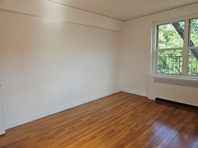 7215 37th Ave Unit 3H, Jackson Heights, NY 11372 - empty room with radiator and light wood finished floors