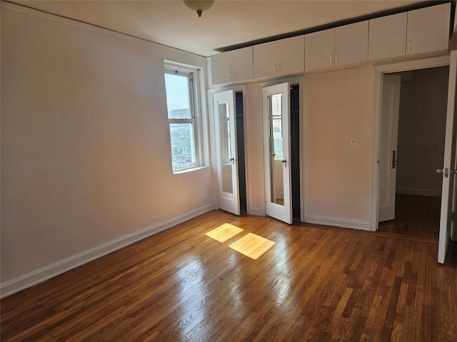 7215 37th Ave Unit 3H, Jackson Heights, NY 11372 - unfurnished bedroom with wood finished floors and baseboards