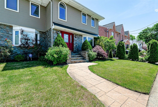 3 Grant Ave, Albertson, NY 11507 - view of front of property with a front lawn and stone siding