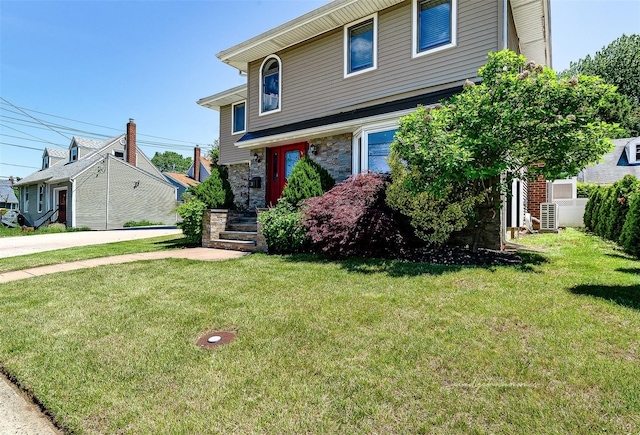 3 Grant Ave, Albertson, NY 11507 - view of front facade featuring a front yard and stone siding