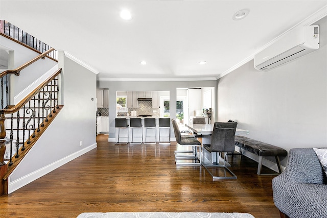 3 Grant Ave, Albertson, NY 11507 - dining space featuring a wall unit AC, crown molding, dark wood-style floors, stairs, and recessed lighting