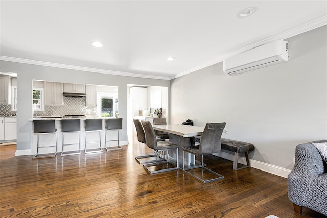 3 Grant Ave, Albertson, NY 11507 - dining area with an AC wall unit, crown molding, dark wood-style floors, and recessed lighting