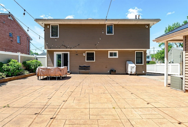 3 Grant Ave, Albertson, NY 11507 - back of property with a fenced backyard and a patio area