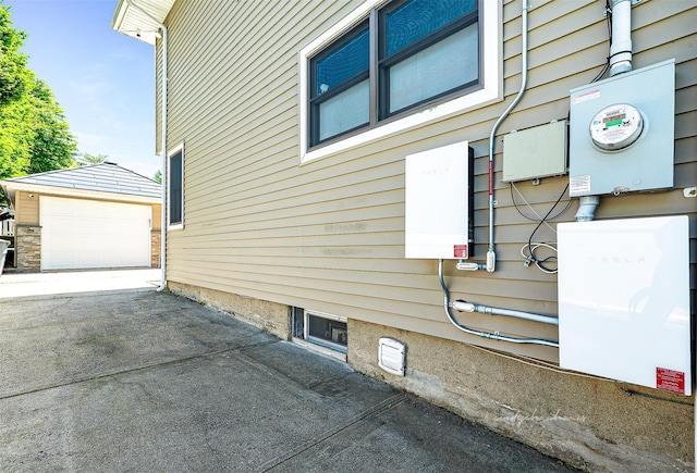 3 Grant Ave, Albertson, NY 11507 - view of side of property with an outbuilding, driveway, and a detached garage