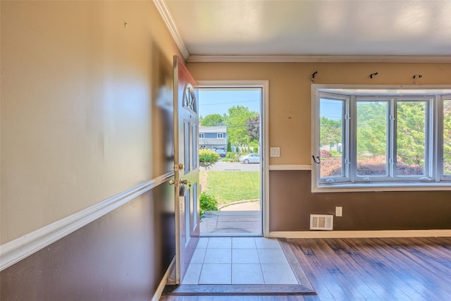 12 Rivera Ln, West Sayville, NY 11796 - doorway featuring ornamental molding and wood-type flooring
