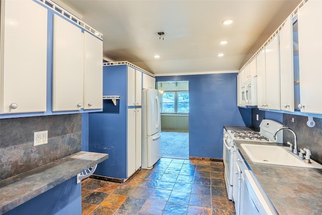 12 Rivera Ln, West Sayville, NY 11796 - kitchen featuring white appliances, dark stone finish flooring, tasteful backsplash, recessed lighting, and white cabinets