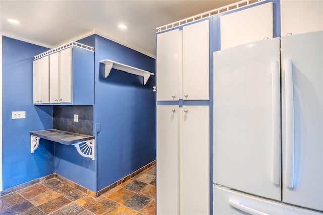 12 Rivera Ln, West Sayville, NY 11796 - kitchen featuring freestanding refrigerator, dark stone finish floors, recessed lighting, and dark countertops